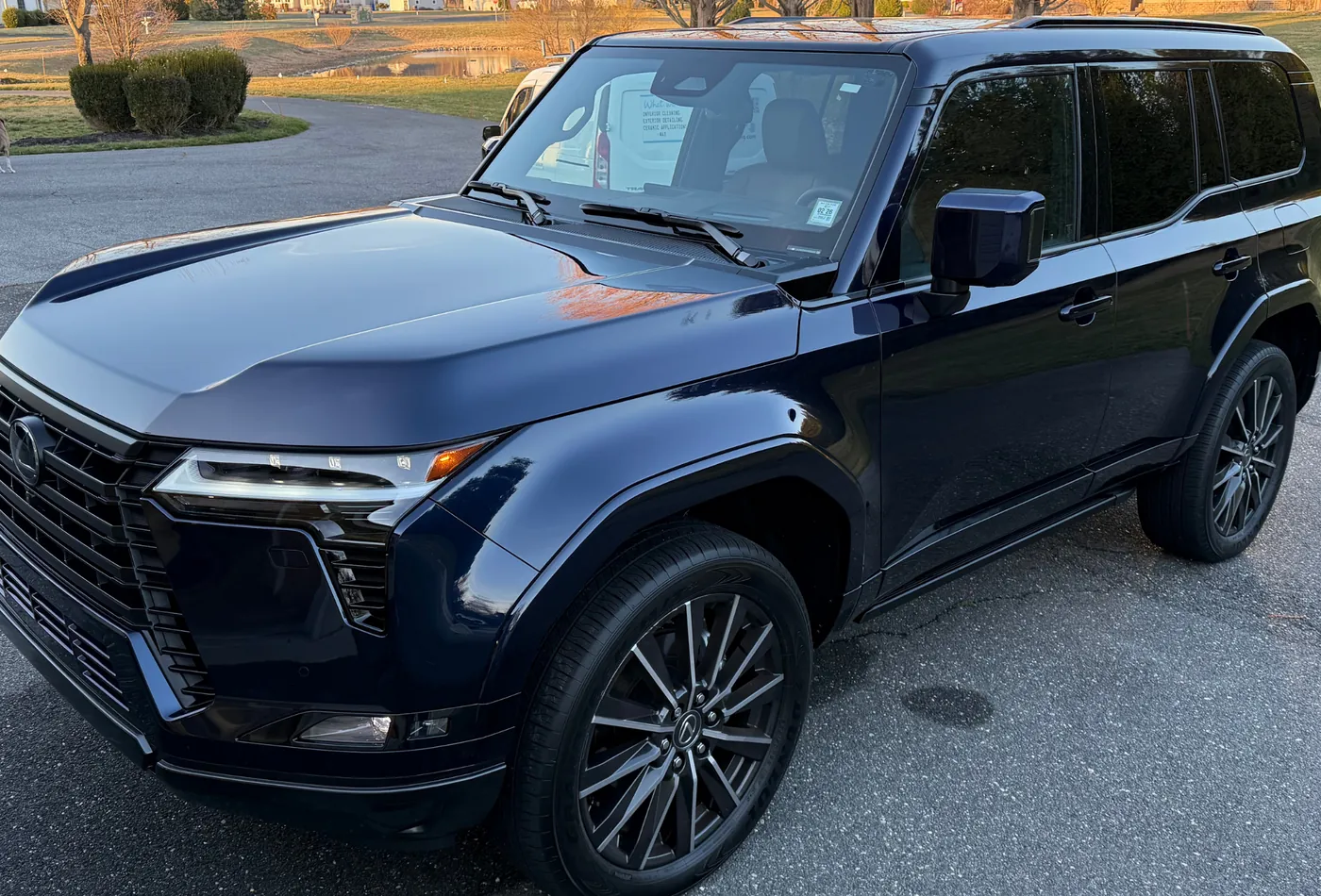 Dark blue Lexus SUV with a deep, even gloss after correction